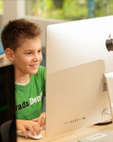 Kid using iMac